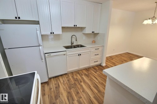 11 1503 Mill Woods Road E, Edmonton, AB - Indoor Photo Showing Kitchen With Double Sink