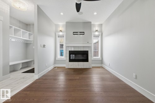 8144 78 Avenue, Edmonton, AB - Indoor Photo Showing Other Room With Fireplace