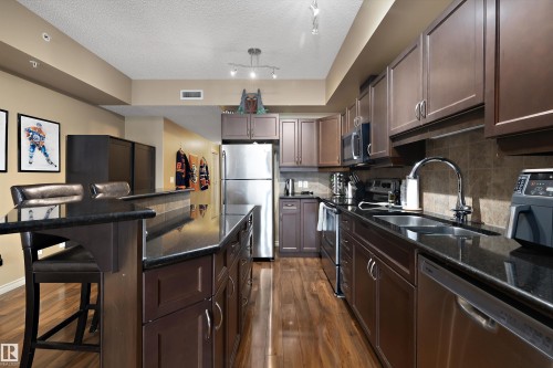 307 10303 111 Street, Edmonton, AB - Indoor Photo Showing Kitchen With Stainless Steel Kitchen With Double Sink