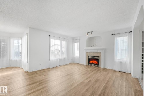 12 Rue Bouchard, Beaumont, AB - Indoor Photo Showing Living Room With Fireplace