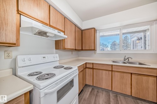 64 4610 17 Avenue, Edmonton, AB - Indoor Photo Showing Kitchen With Double Sink