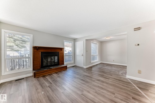 64 4610 17 Avenue, Edmonton, AB - Indoor Photo Showing Living Room With Fireplace