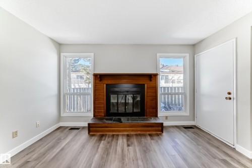 64 4610 17 Avenue, Edmonton, AB - Indoor Photo Showing Living Room With Fireplace