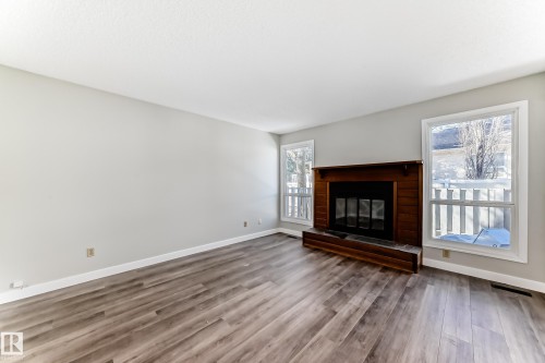64 4610 17 Avenue, Edmonton, AB - Indoor Photo Showing Living Room With Fireplace