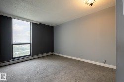 Large primary bed room with window and city and river va;lley view - 