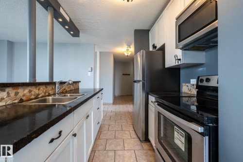 upgraded open kitchen - 911 10883 Saskatchewan Drive, Edmonton, AB - Indoor Photo Showing Kitchen With Stainless Steel Kitchen With Double Sink