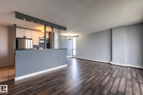 Kitchen opens to the living area - 911 10883 Saskatchewan Drive, Edmonton, AB - Indoor Photo Showing Kitchen