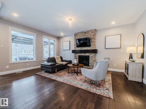 2611 Blue Jay Close, Edmonton, AB - Indoor Photo Showing Living Room With Fireplace