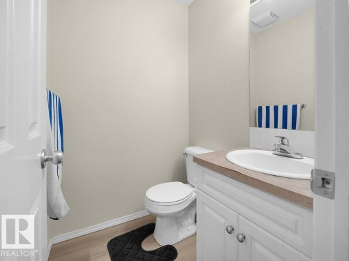 Bathroom featuring vanity and light wood-style floors - 196 230 Edwards Drive, Edmonton, AB - Indoor Photo Showing Bathroom