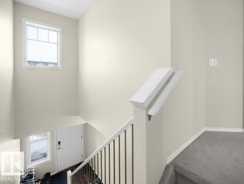 Stairs with carpet and baseboards - 196 230 Edwards Drive, Edmonton, AB - Indoor Photo Showing Other Room