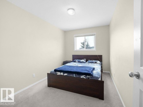 Carpeted bedroom with baseboards - 196 230 Edwards Drive, Edmonton, AB - Indoor Photo Showing Bedroom