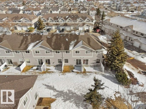Snowy aerial view featuring a residential view - 196 230 Edwards Drive, Edmonton, AB - Outdoor