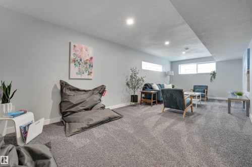 Carpeted office space featuring baseboards and recessed lighting - 13932 118 Avenue, Edmonton, AB - Indoor