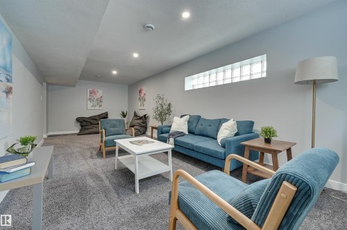 Living room featuring carpet flooring and recessed lighting - 13932 118 Avenue, Edmonton, AB - Indoor