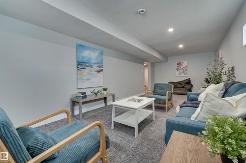 Carpeted living room with recessed lighting - 13932 118 Avenue, Edmonton, AB - Indoor Photo Showing Living Room