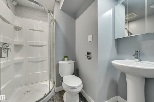 Bathroom featuring a shower stall and wood finished floors - 13932 118 Avenue, Edmonton, AB - Indoor Photo Showing Bathroom