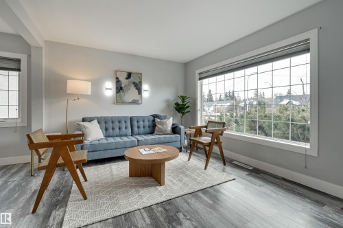 Living room with wood finished floors and baseboards - 13932 118 Avenue, Edmonton, AB - Indoor Photo Showing Living Room