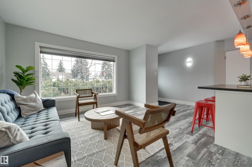 Living area with light wood finished floors - 13932 118 Avenue, Edmonton, AB - Indoor Photo Showing Living Room