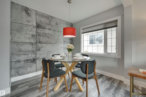 Dining room with wood finished floors and baseboards - 13932 118 Avenue, Edmonton, AB - Indoor Photo Showing Dining Room