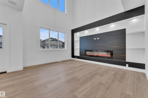 209 Basin Court, Leduc, AB - Indoor Photo Showing Other Room With Fireplace