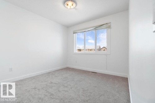 221 Cy Becker Blvd, Edmonton, AB - Indoor Photo Showing Other Room