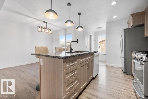 221 Cy Becker Blvd, Edmonton, AB - Indoor Photo Showing Kitchen With Upgraded Kitchen