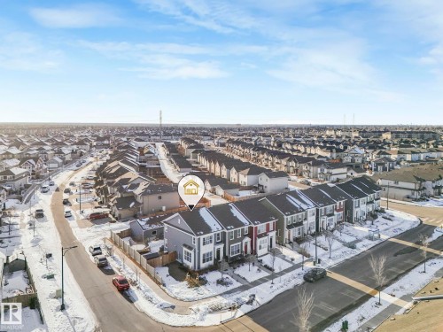Aerial view of the neighborhood showcasing rows of properties with dark-colored roofs and a clear sky overhead - 1920 24 Street, Edmonton, AB - Outdoor With View