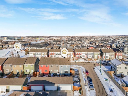 Aerial view showcasing the property within a residential community featuring diverse exterior facades and a street with parked vehicles - 1920 24 Street, Edmonton, AB - Outdoor With View