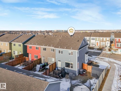 This property features a fenced backyard with a shed and a paved pathway - 1920 24 Street, Edmonton, AB - Outdoor