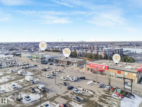The property is situated within a vibrant community, offering convenient proximity to various retail and dining establishments - 1920 24 Street, Edmonton, AB - Outdoor With View