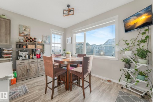 This area features large windows providing ample natural light and views of the surrounding neighborhood - 1920 24 Street, Edmonton, AB - Indoor Photo Showing Dining Room