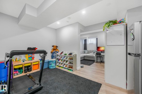 The property features light-colored walls and flooring, with recessed lighting throughout - 1920 24 Street, Edmonton, AB - Indoor Photo Showing Other Room