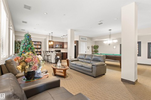 425 6083 Maynard Way, Edmonton, AB - Indoor Photo Showing Living Room
