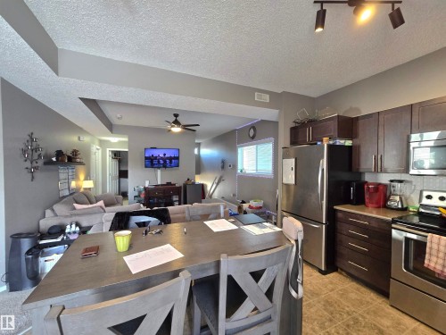 24 6520 2 Avenue Sw, Edmonton, AB - Indoor Photo Showing Kitchen With Stainless Steel Kitchen