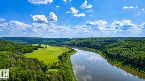 Expansive river setting with a lush green floodplain, surrounded by dense woodland - Rge Rd 102 Twp Rd 552A, Rural St. Paul County, AB 