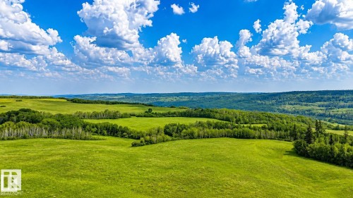 Expansive green fields featuring natural rolling terrain and scattered mature trees - Rge Rd 102 Twp Rd 552A, Rural St. Paul County, AB 