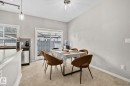 Dining space with baseboards and a textured ceiling - 11 3710 Allan Drive, Edmonton, AB  - Indoor Photo Showing Dining Room 