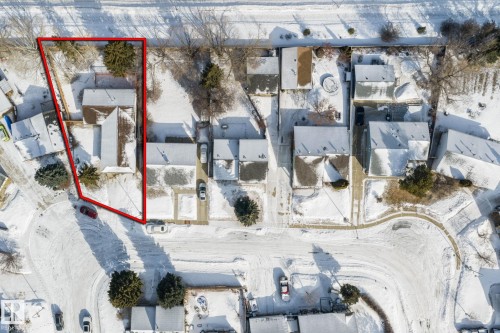 Aerial view of the property, showcasing its location within a residential area with other properties and streets - 18124 68Ave, Edmonton, AB - Outdoor