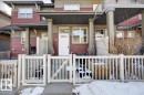 The property features a red facade with horizontal siding and grey trim - 33 4029 Orchards Drive Sw, Edmonton, AB  - Outdoor With Deck Patio Veranda With Facade 