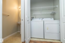 Laundry room featuring washer and clothes dryer and baseboards - 