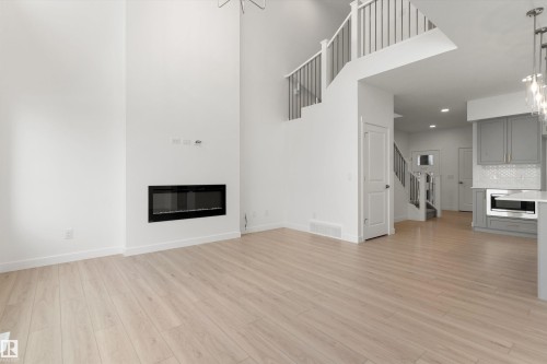 19127 20 Avenue, Edmonton, AB - Indoor Photo Showing Living Room With Fireplace