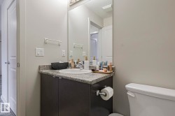 Bathroom featuring toilet and vanity - 