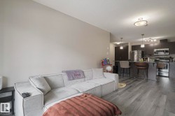 Living area featuring dark wood-type flooring - 