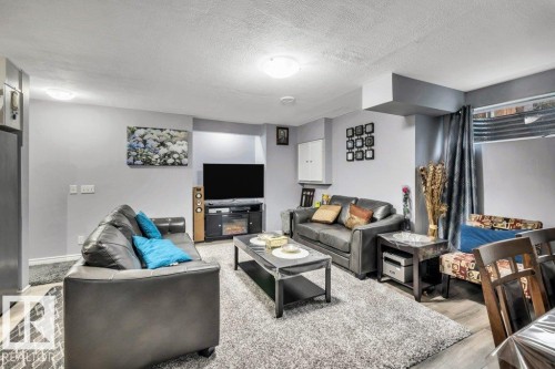 3740 29 Street, Edmonton, AB - Indoor Photo Showing Living Room With Fireplace