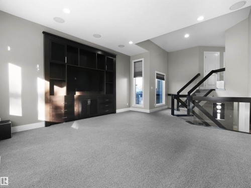 Workout room with light colored carpet and recessed lighting - 59 10550 Ellerslie Road, Edmonton, AB - Indoor Photo Showing Other Room