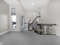 Stairs with carpet flooring and baseboards - 