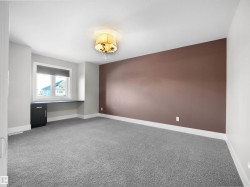 Unfurnished room with light carpet and baseboards - 