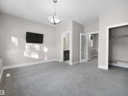 Unfurnished bedroom with carpet, ensuite bathroom, and a closet - 
