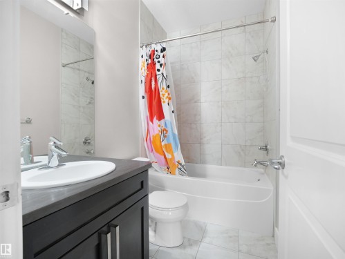 Bathroom with vanity and shower / tub combo - 59 10550 Ellerslie Road, Edmonton, AB - Indoor Photo Showing Bathroom