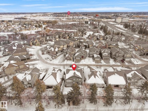 Snowy aerial view with a residential view - 59 10550 Ellerslie Road, Edmonton, AB - Outdoor With View